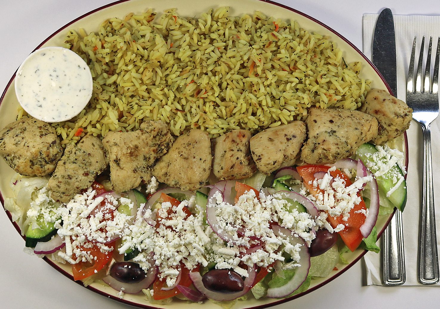 Fireside Welland Restaurant Chicken Souvlaki dinner with Greek salad and rice