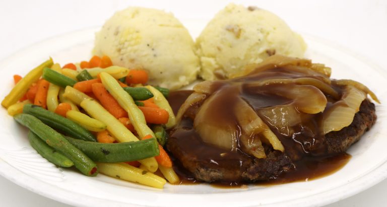 Fireside Welland restaurant hamburger chopped steak with sauteed onions mashed potatoes and veggies