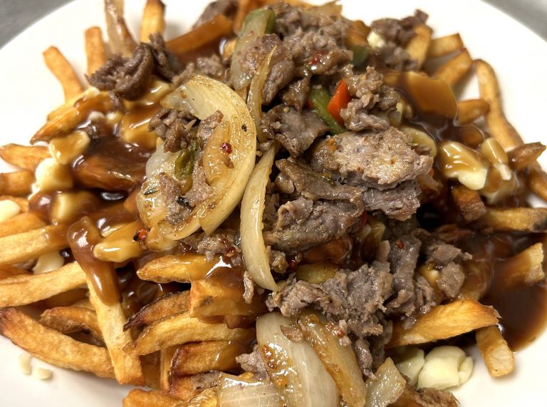 Fireside Welland restaurant steak poutine with grilled mushrooms and peppers and Quebec cheese curds