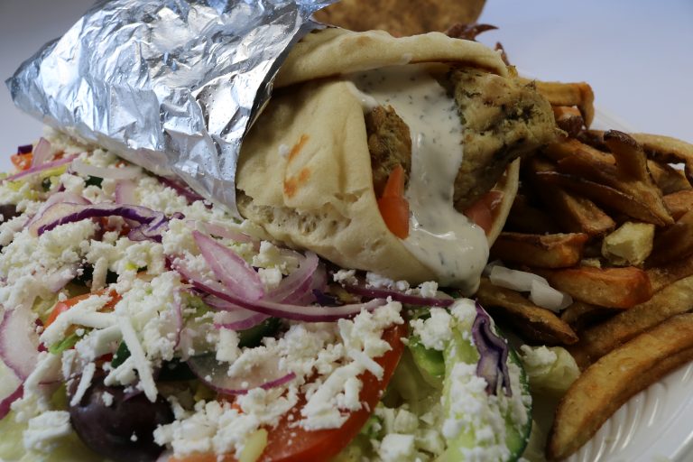 Fireside Welland restaurant chicken souvlaki pita with Greek Salad and fresh cut fries